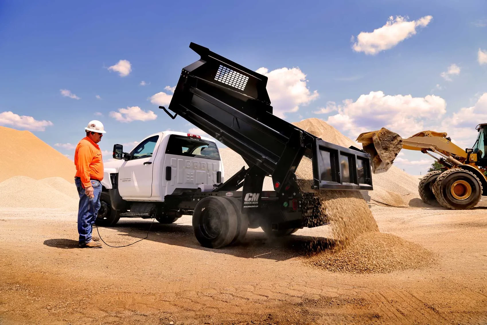 Dump truck tilting bed