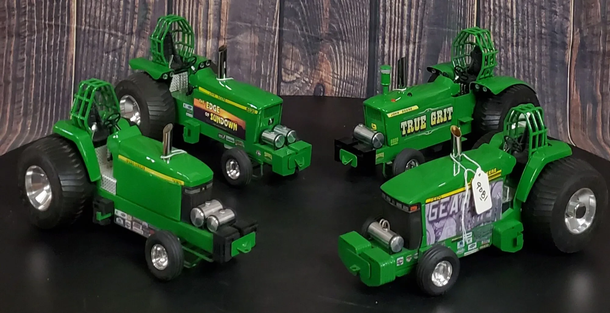 collection of diecast tractor pulling toys