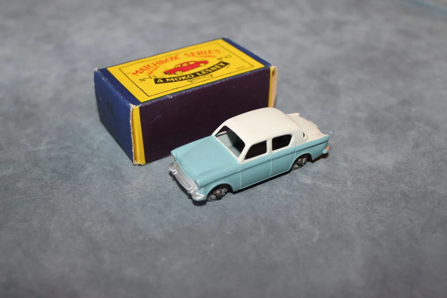 Hillman Super Minx diecast model in a display case