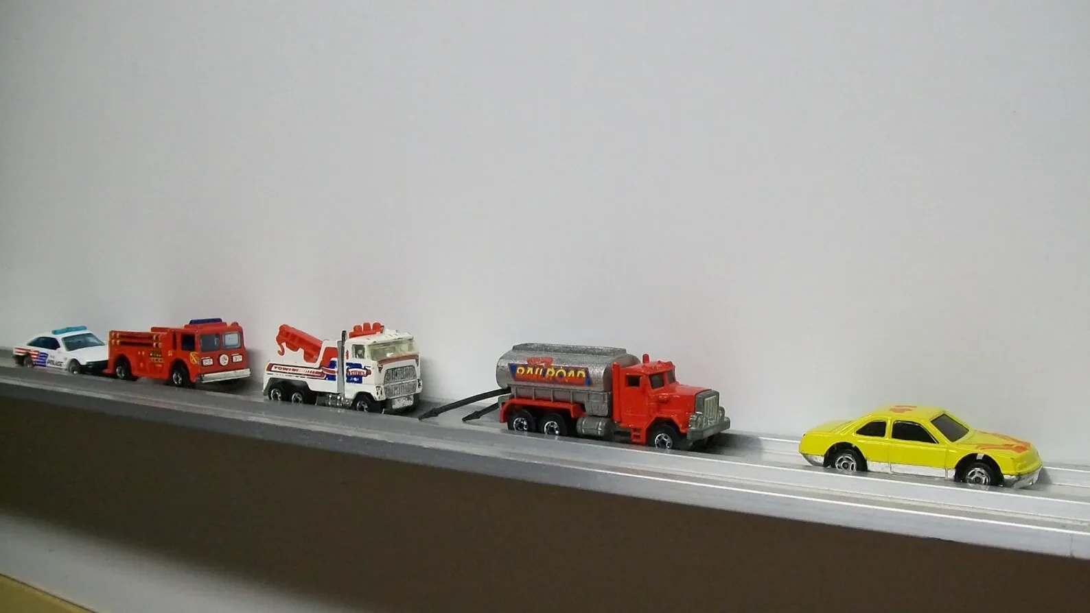 Matchbox cars on shelf