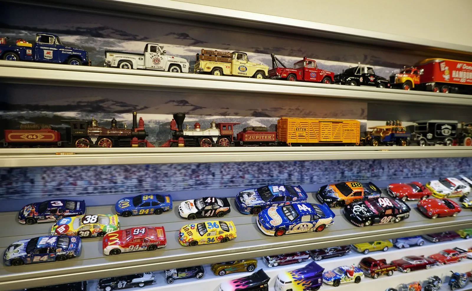 Variety of diecast equipment toys displayed
