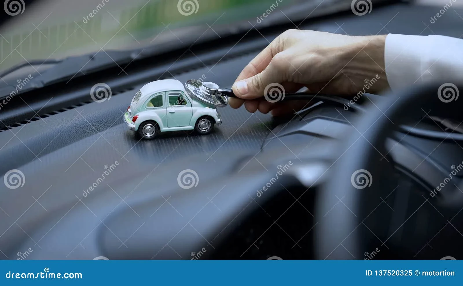 A collector carefully examining a diecast car