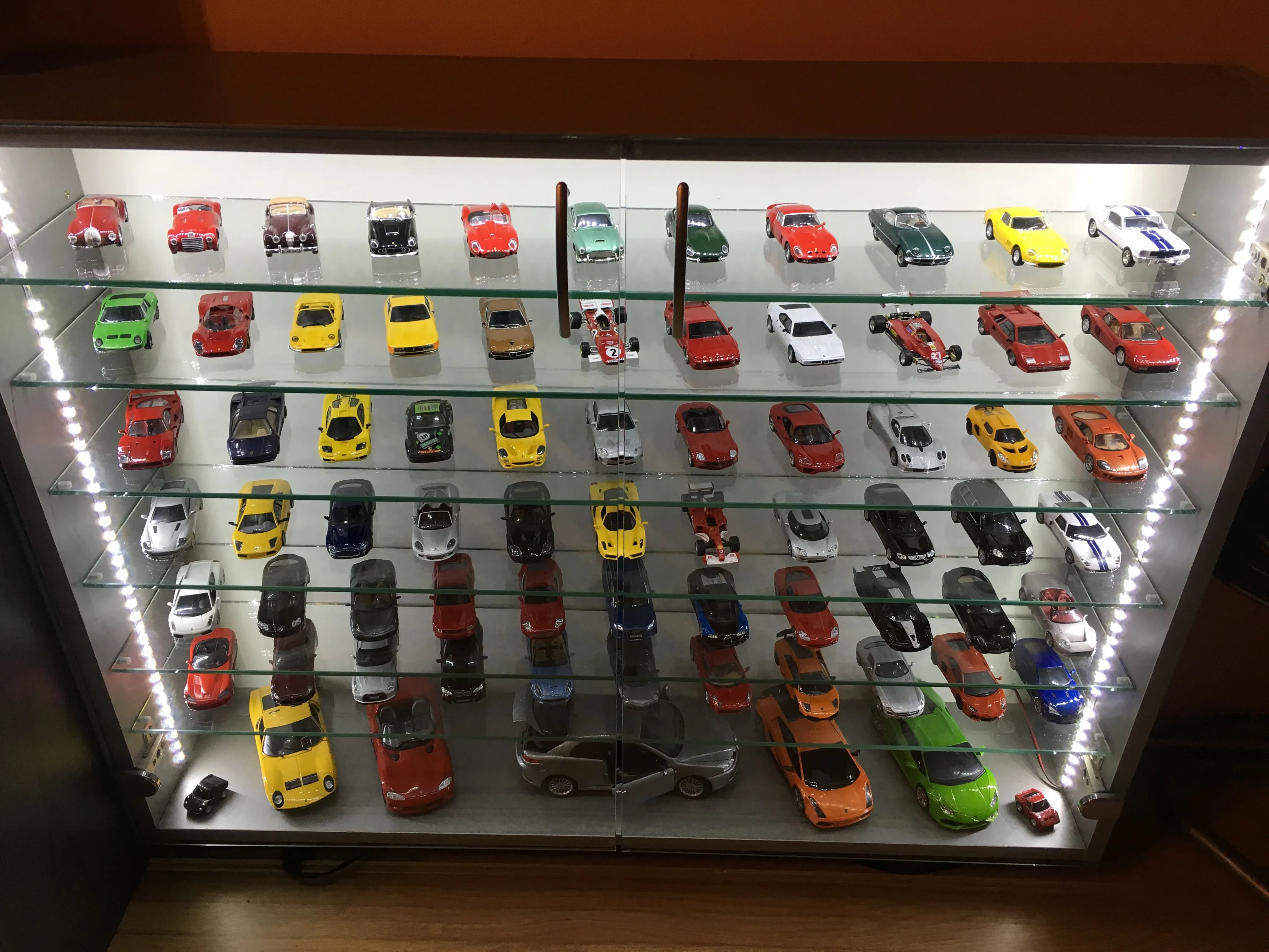 Kiwi Customs diecast model in a display case