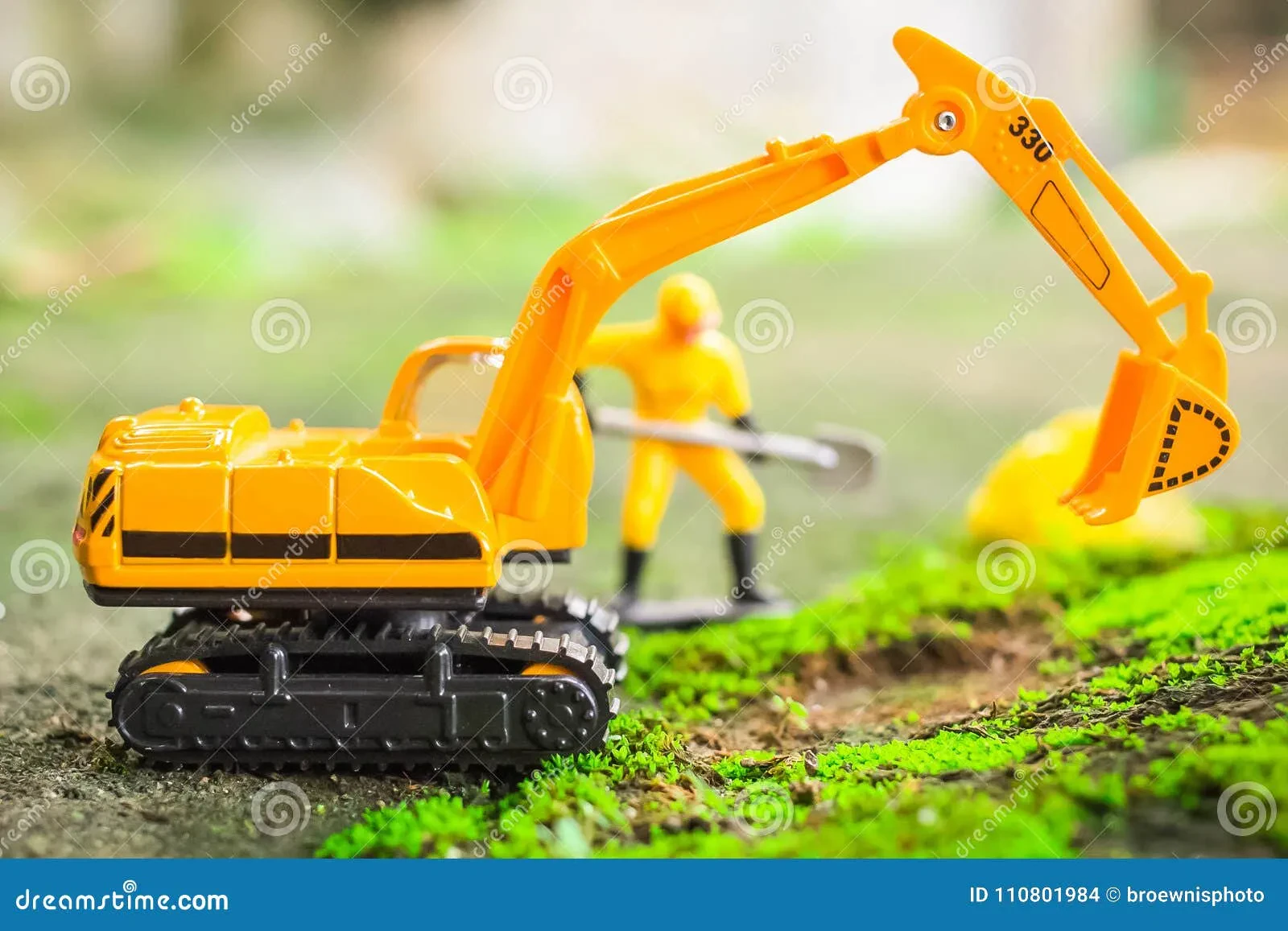 Child playing with diecast construction toys 2024